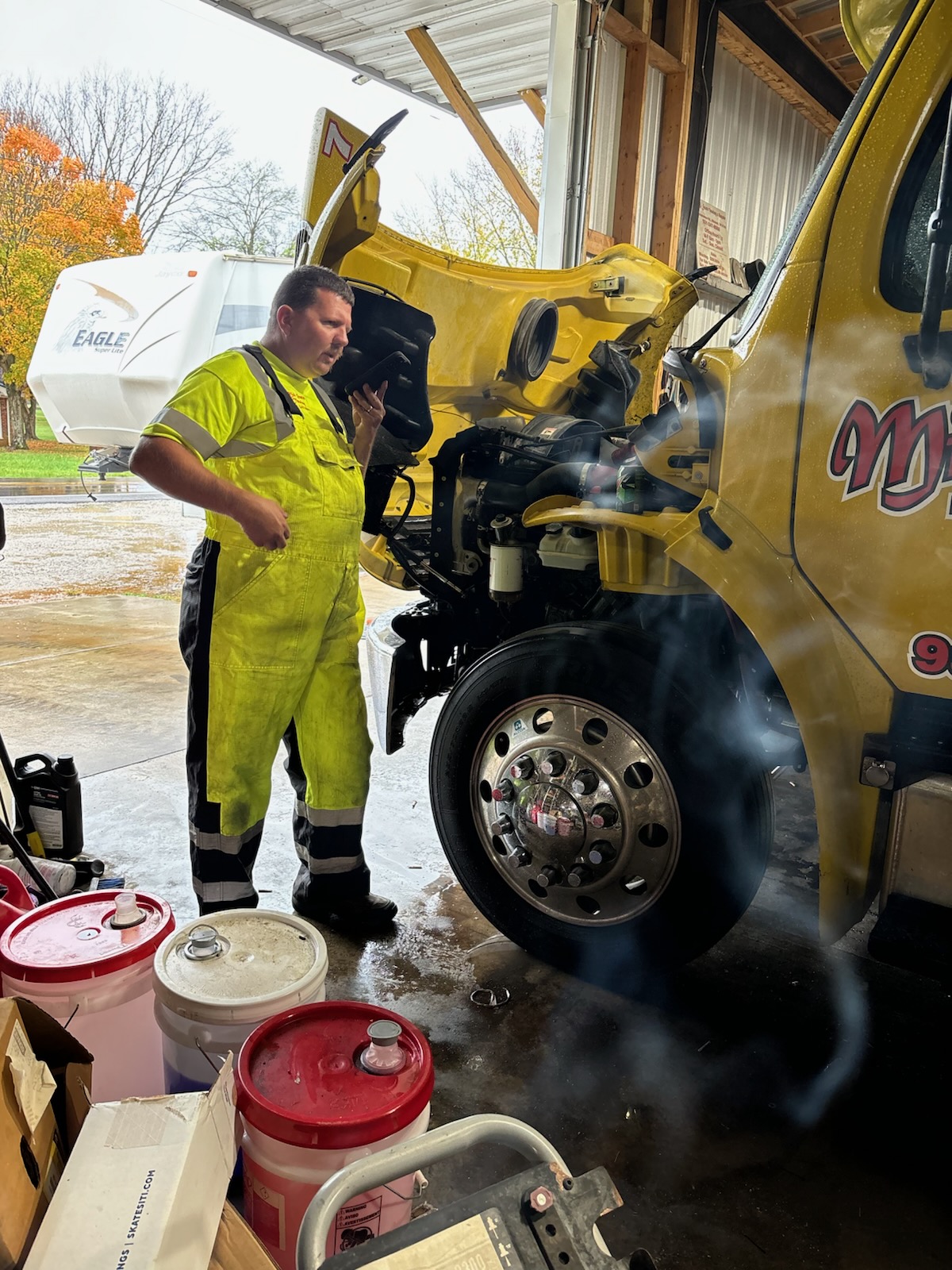 This is our son-in-law Brian,  proudly servicing the company trucks.