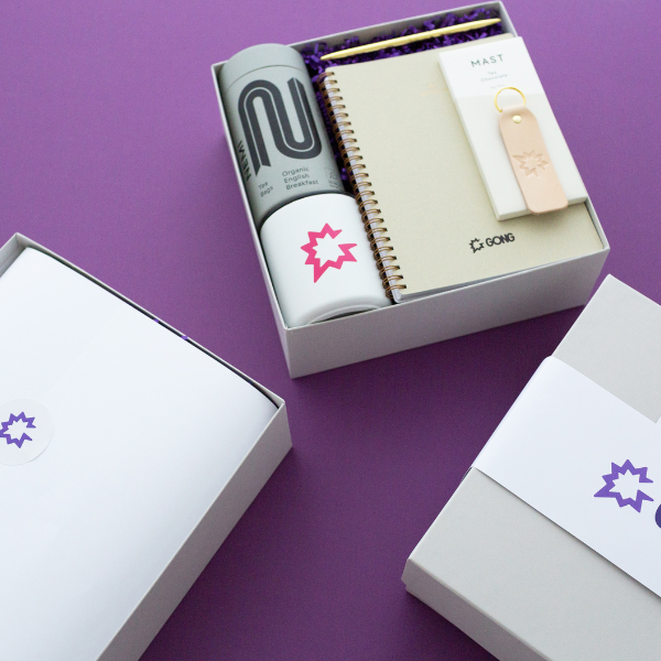 Corporate gift boxes on purple background.