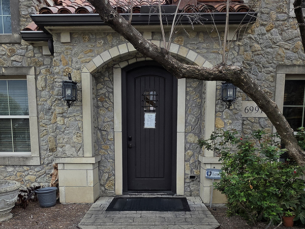 Exterior photo of front door of the AudioNova hearing clinic in McKinney, TX