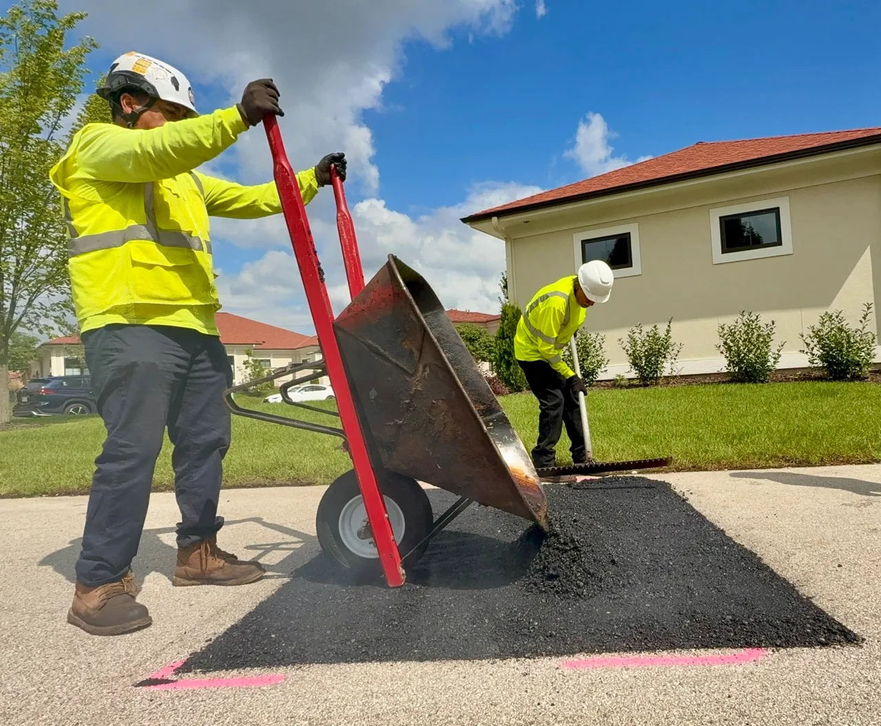PLM crew performing asphalt patching.