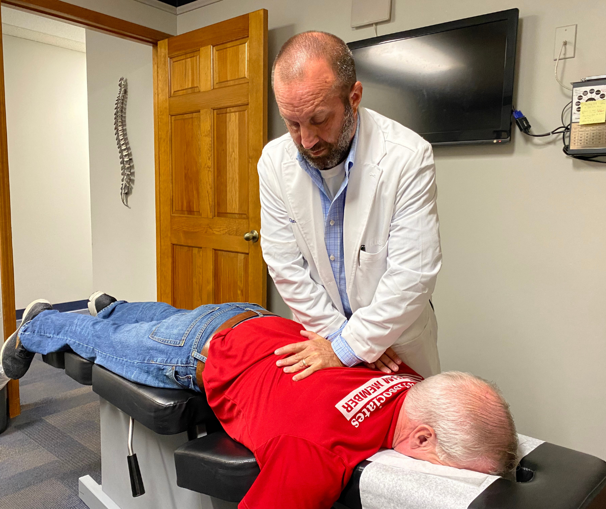 Chiropractor Dr. David Fike adjusts a patient's back at Fike Chiropractic & Acupuncture - Tulsa
