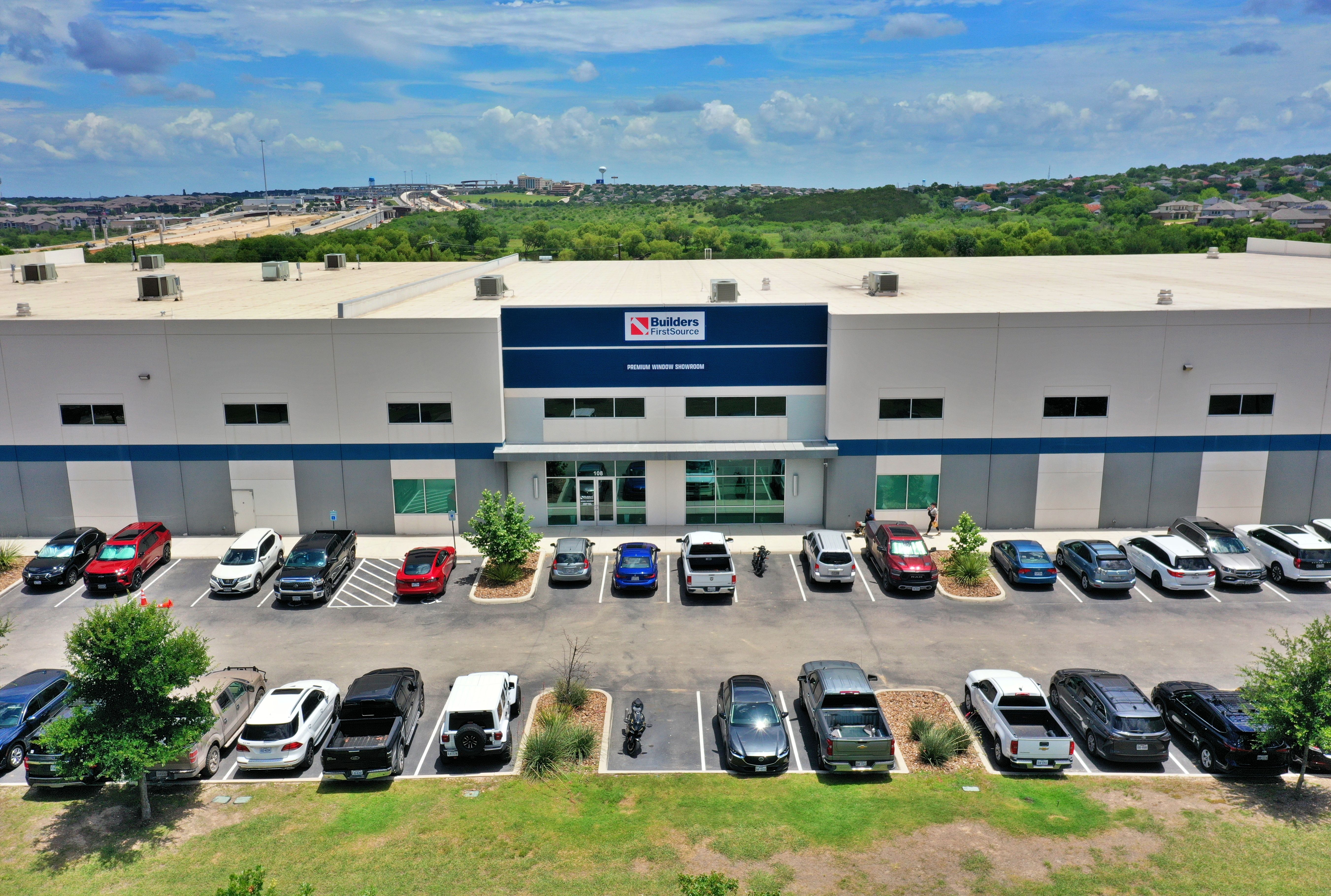 Aerial front view of the Builders FirstSource Premium Window Showroom in San Antonio, featuring a la 