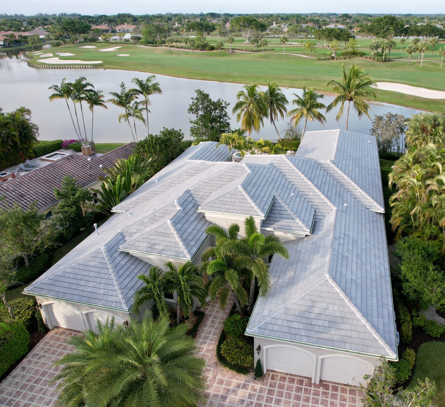 This flat roof tile color is called Royal Palm. Roof replacement complete.