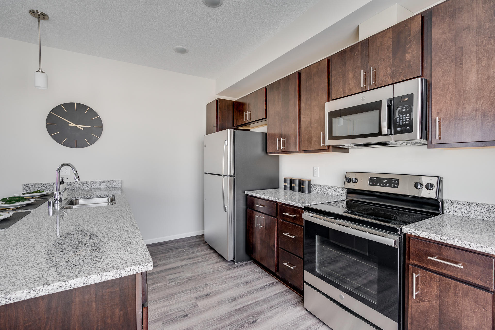 Fully Equipped Kitchen With Stainless Steel Appliances & Granite Countertops