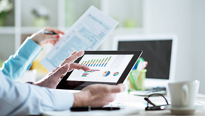 A wealth professional reviewing charts.