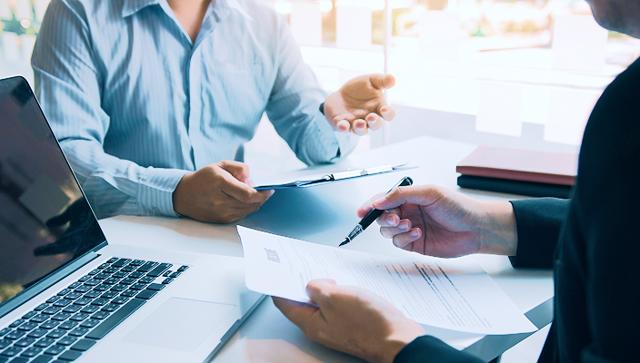 An accountant and a client reviewing documents.