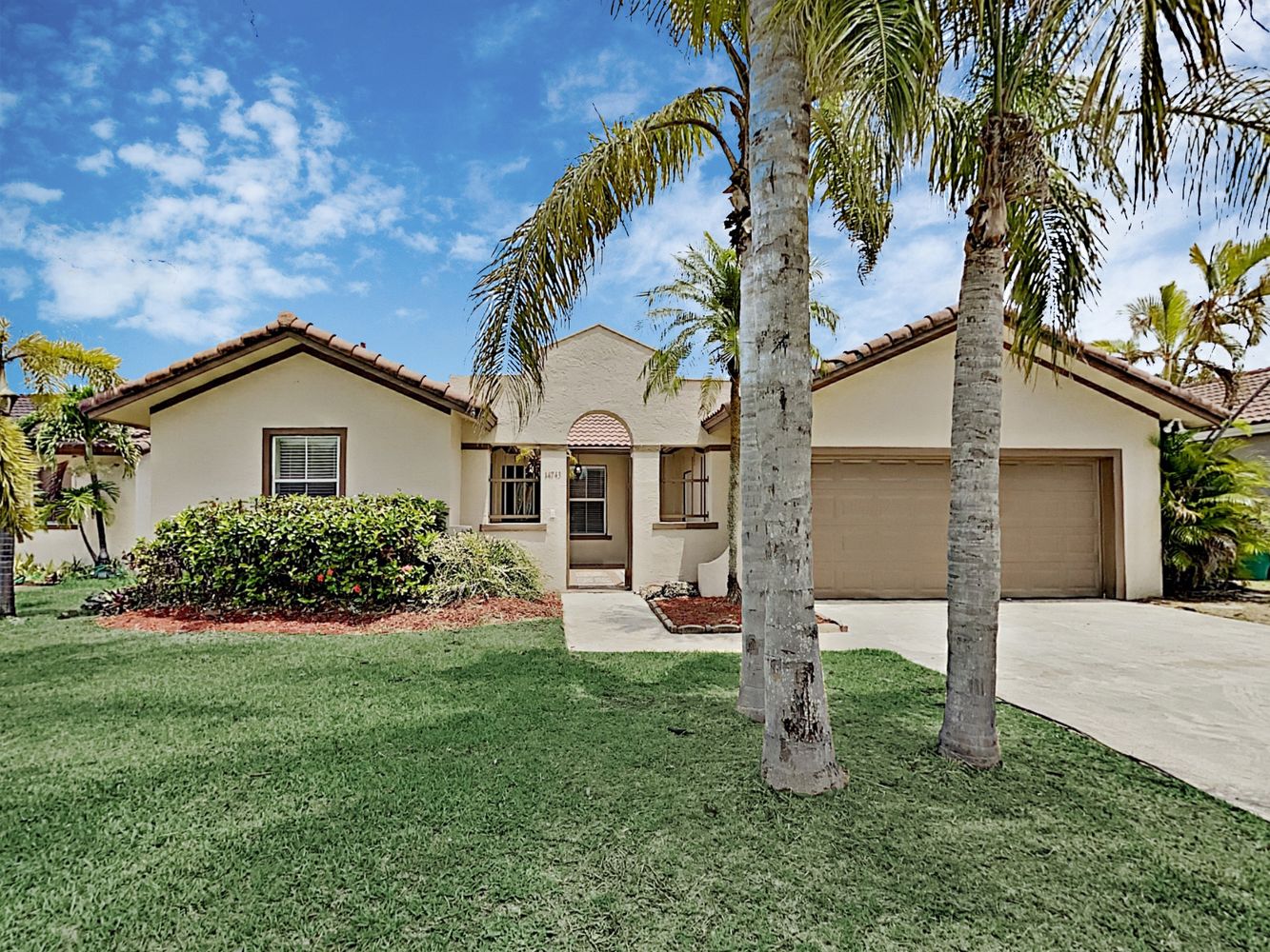 Beautiful Invitation Homes property with a two-car garage in South Florida.