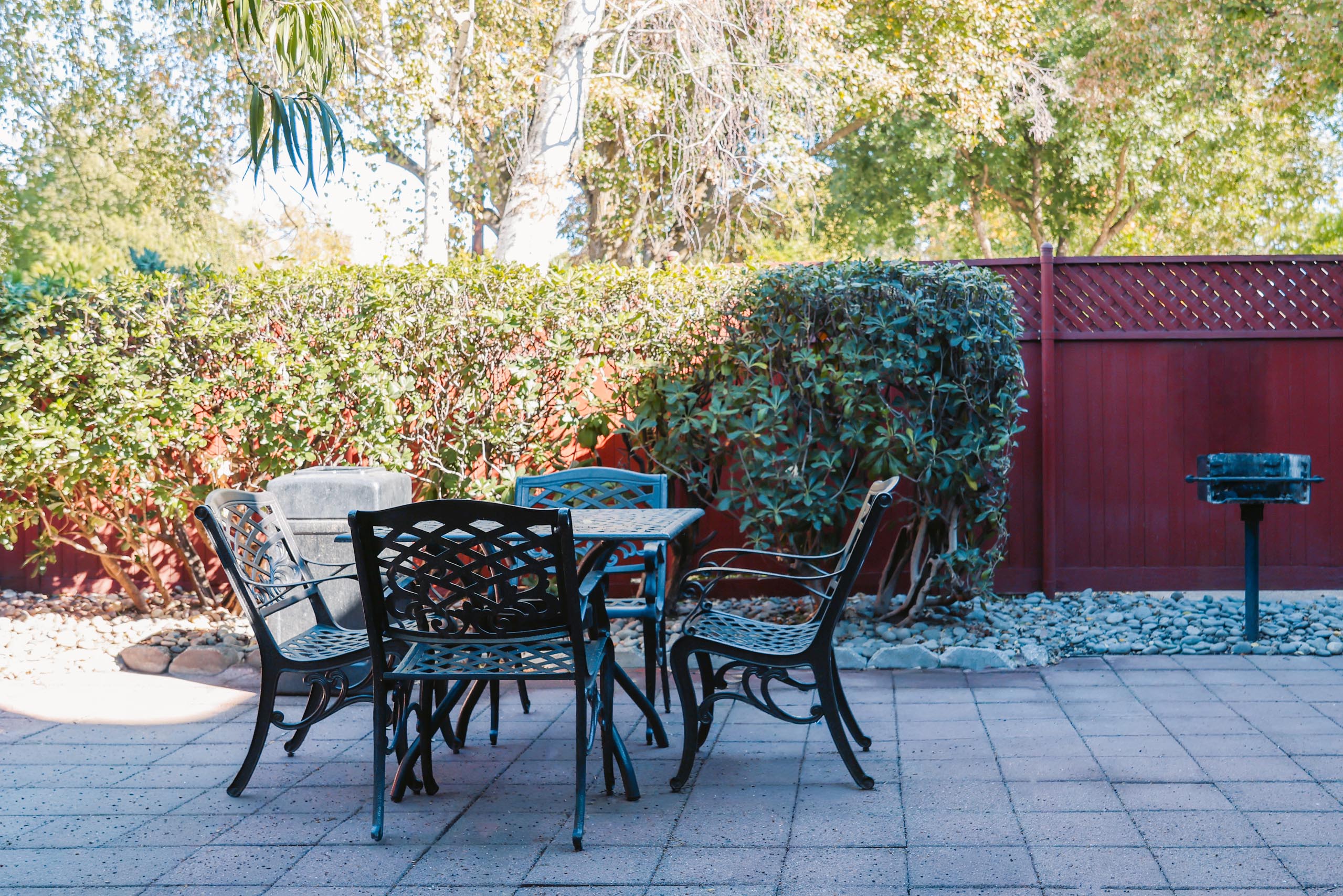 A table with chairs is set up outside at I Street Apartments, Davis, California