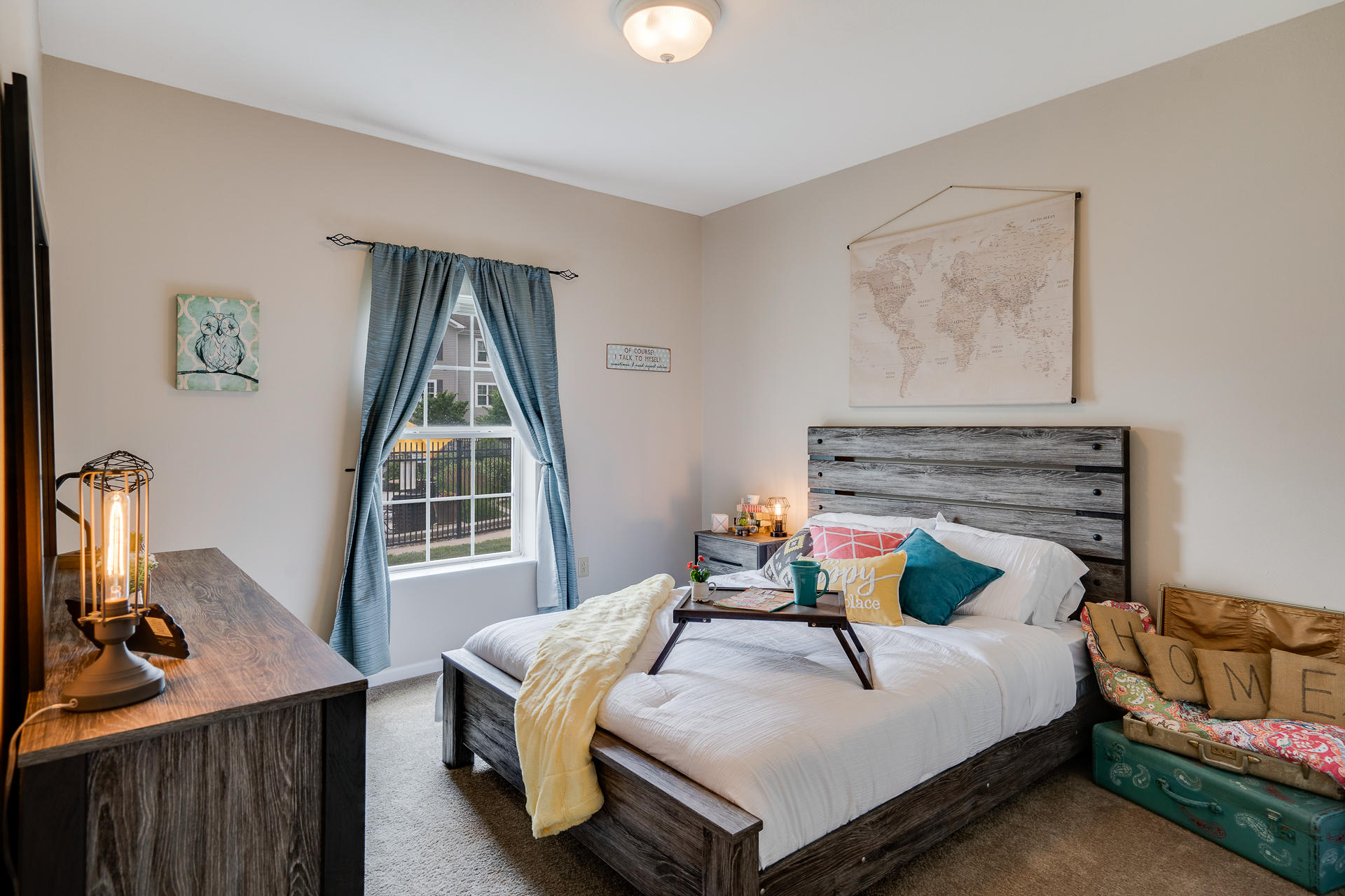 Bedroom With Tall Ceilings & Large Window