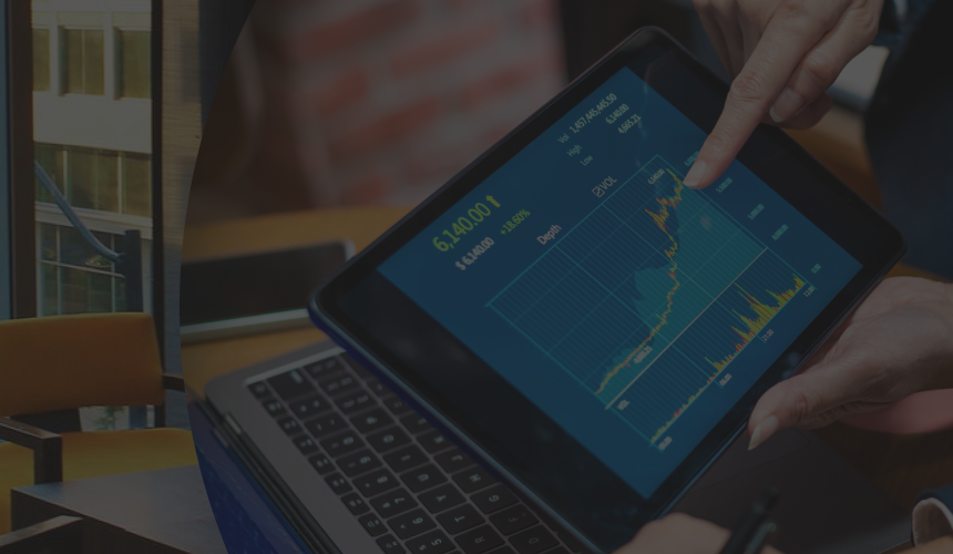 Someone pointing to an uptrend graph on a tablet.