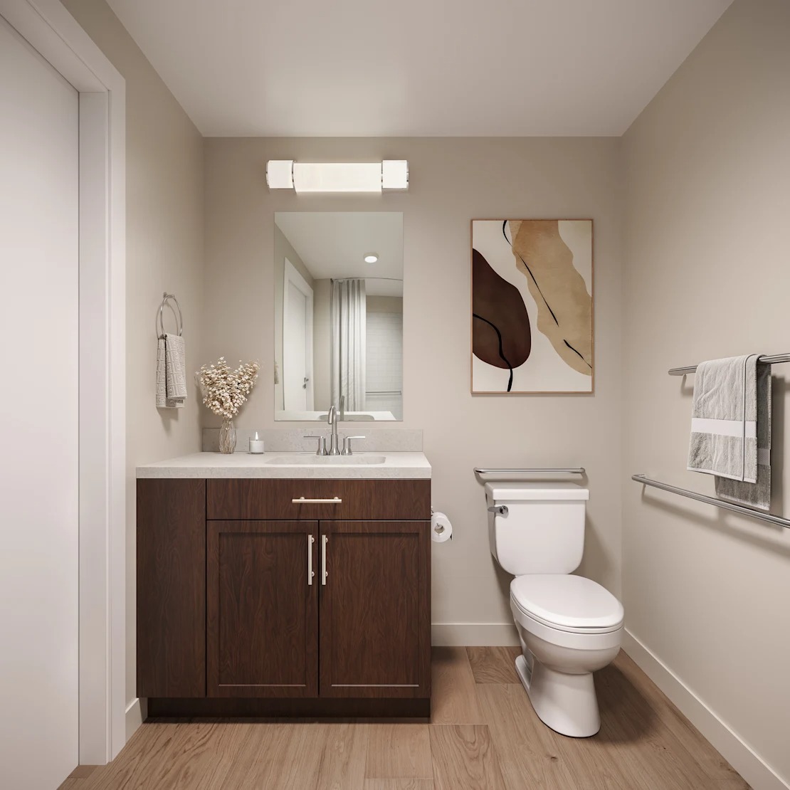 A bathroom with a toilet, sink, and wooden cabinets. 