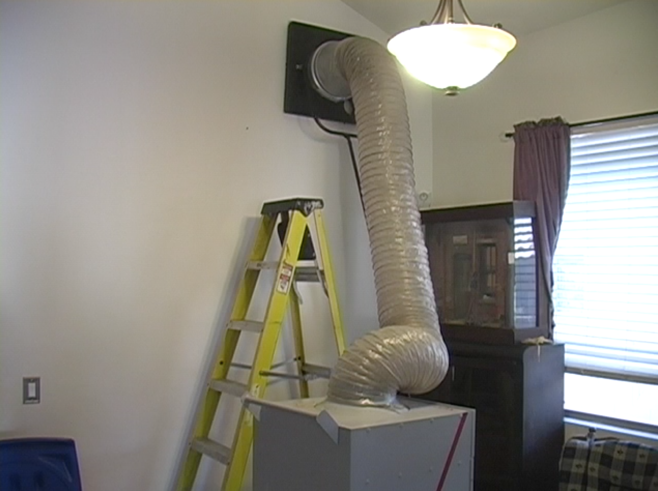 HEPA vacuum hooked up to air ducts system in Phoenix home.