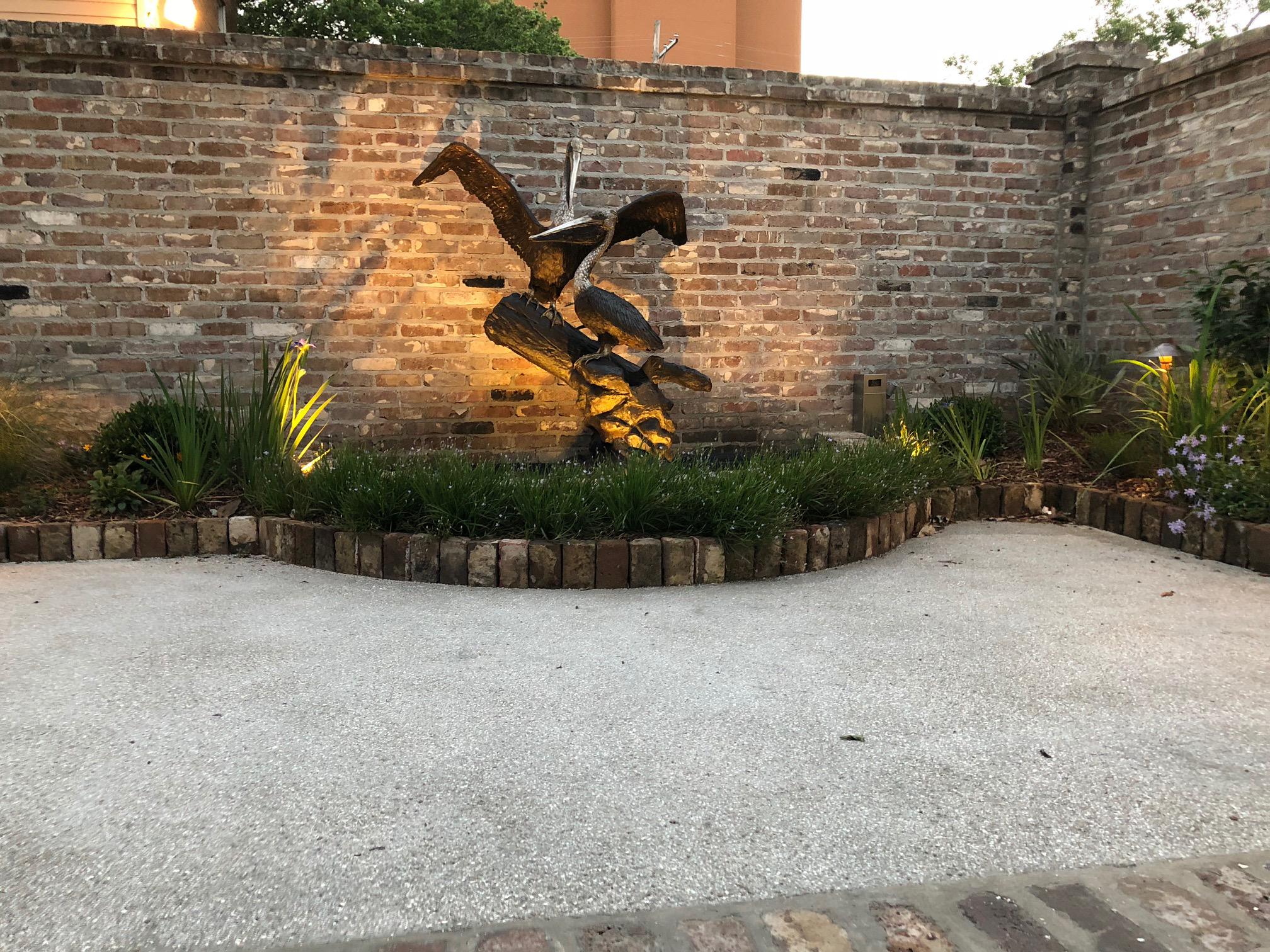 Pelican Coast Conservancy - Mobile, Alabama . Renovated courtyard featuring spectacular bronze pelican installed by JubileeScape