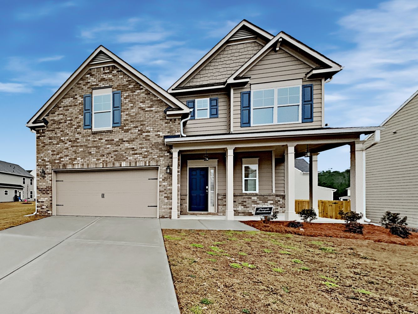 Front of home with covered patio and garage at Invitation Homes Atlanta.