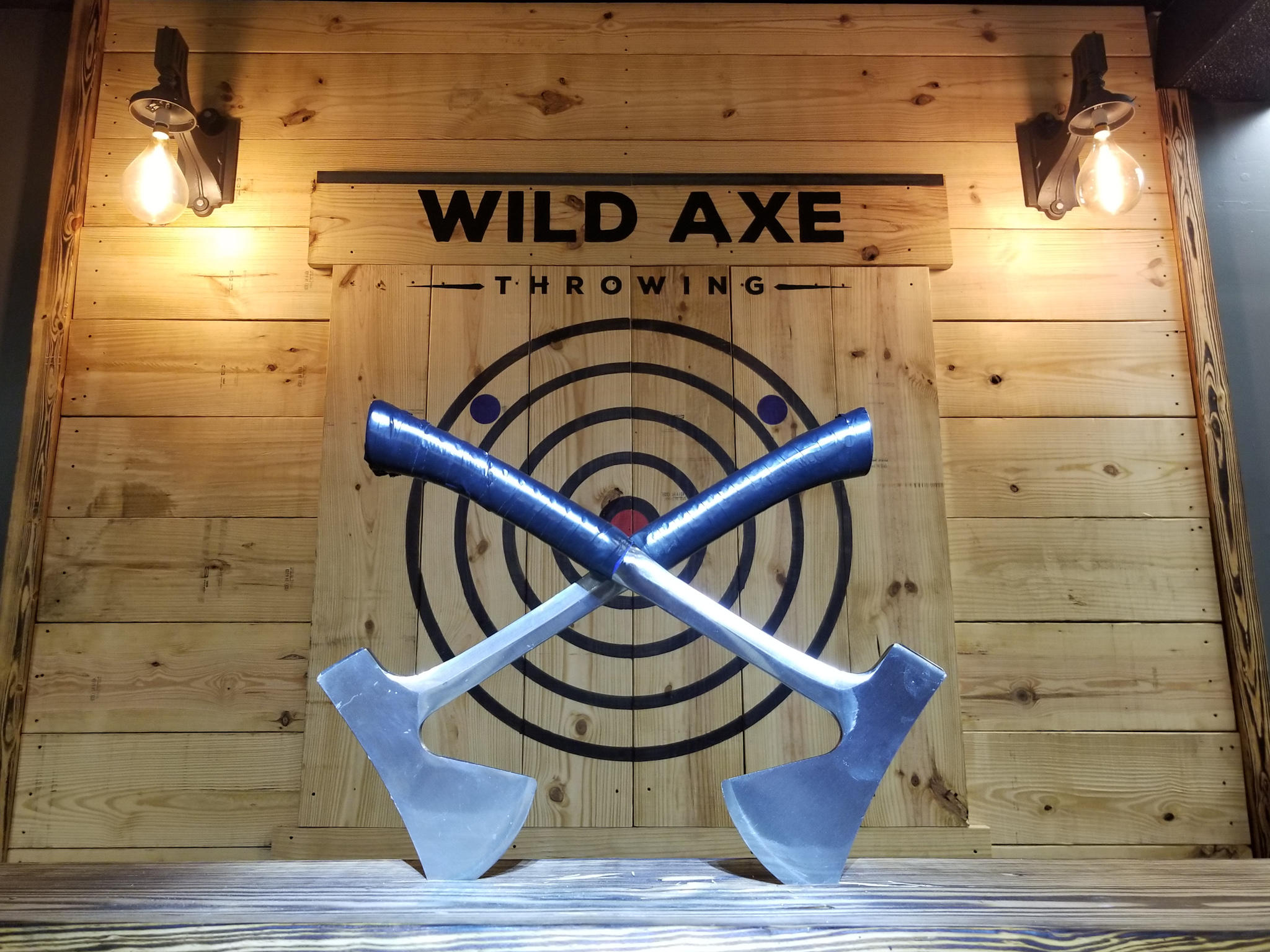 We have the largest axe throwest target in the world which doubles as our photo wall!