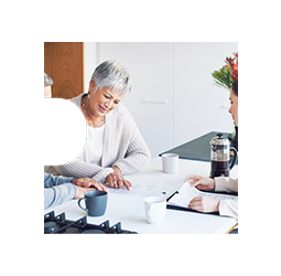 A couple reviewing their finances with an advisor.