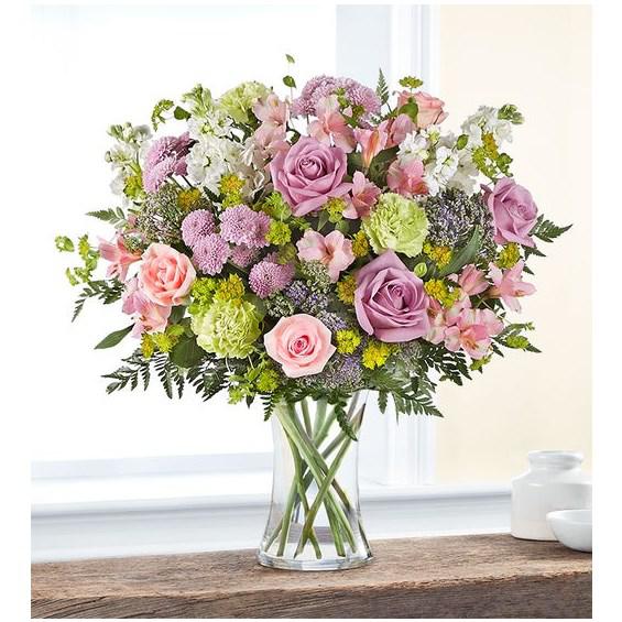 Charming Garden™ Bouquet - With a charm and beauty all its own, our garden-inspired bouquet brightens every day. A loose gathering of pastel blooms creates a fresh-picked look, complete with lush touches of greenery.