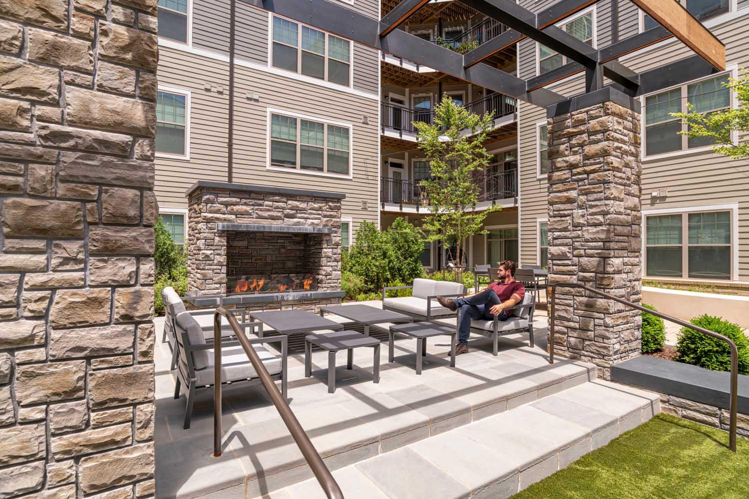 Gather with friends around the outdoor fireplace