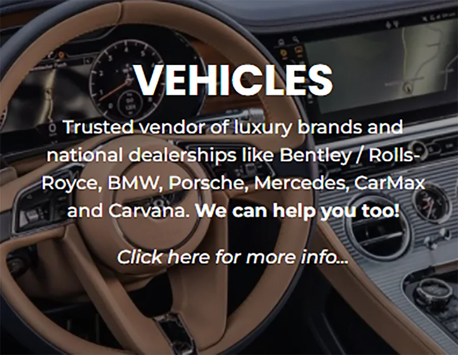 A close-up shot inside a luxury car, featuring a tan leather steering wheel with a digital dashboard and navigation screen visible in the background. White text overlays the image, with the largest text reading "VEHICLES", followed by a description of services for luxury car brands and dealerships, and a call to action to "Click here for more info...".