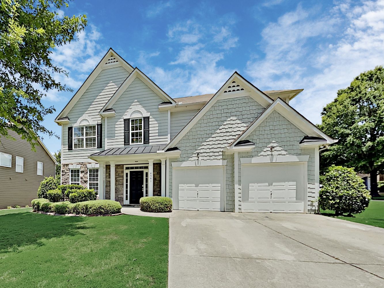 Modern home with two-car garage at Invitation Homes Atlanta.