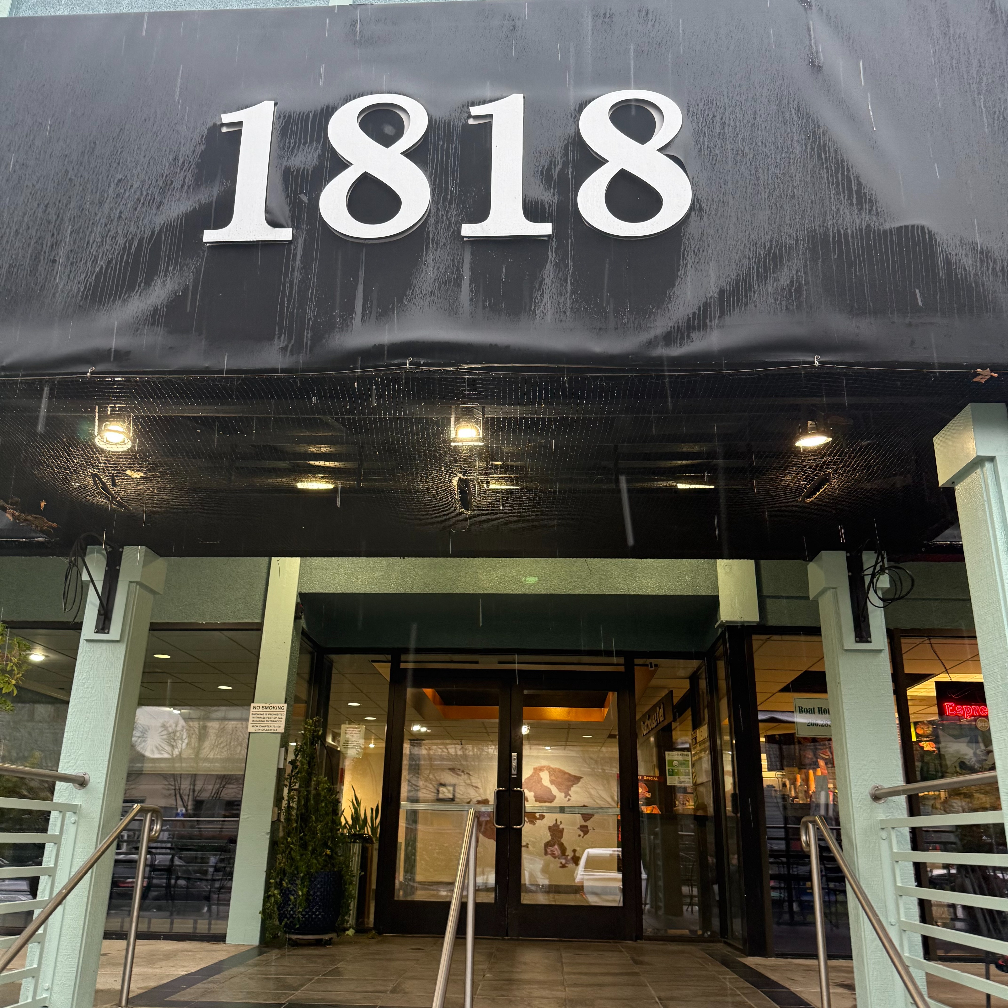 Entrance to main building at Flow Wellness | Seattle. 2 hour parking in front of this building is available.