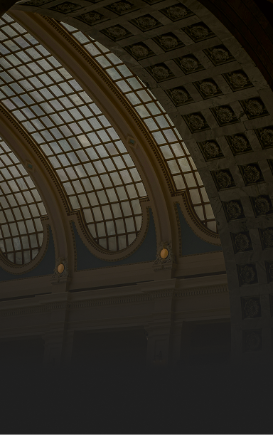 An interior shot of beautiful municipality building with a glass-domed ceiling.