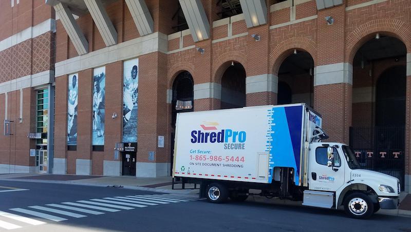 ShredPro Secure mobile shredding truck in front of Neyland Stadium