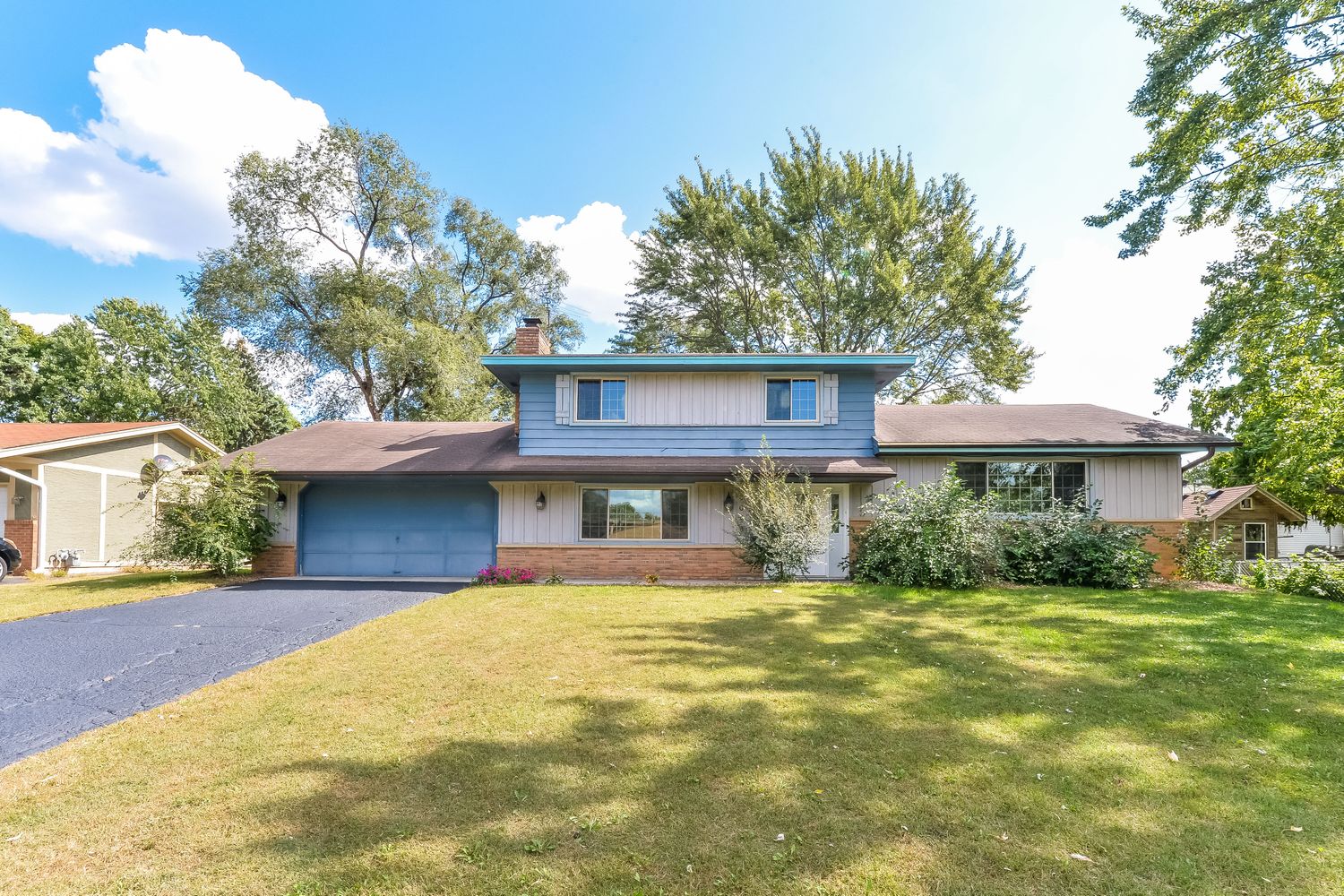 Unique home with long driveway and two-car garage at Invitation Homes Minneapolis.