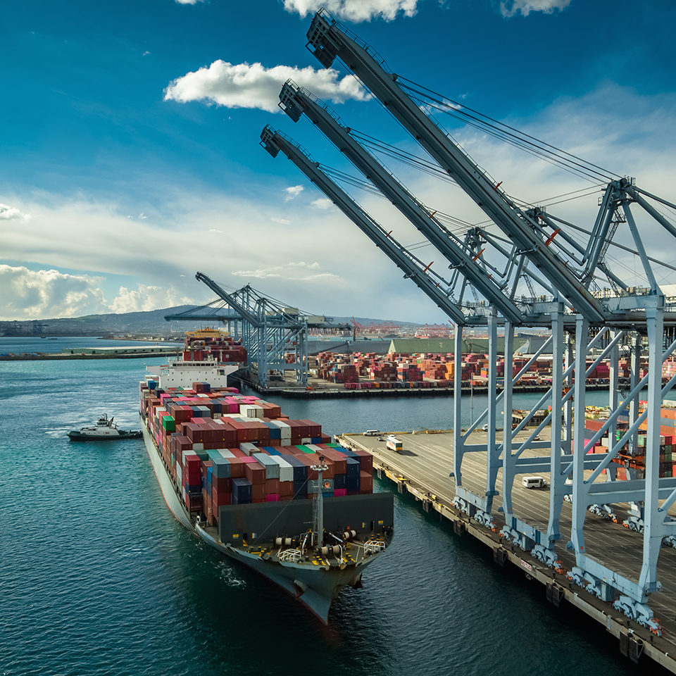 A shipping container boat at a port