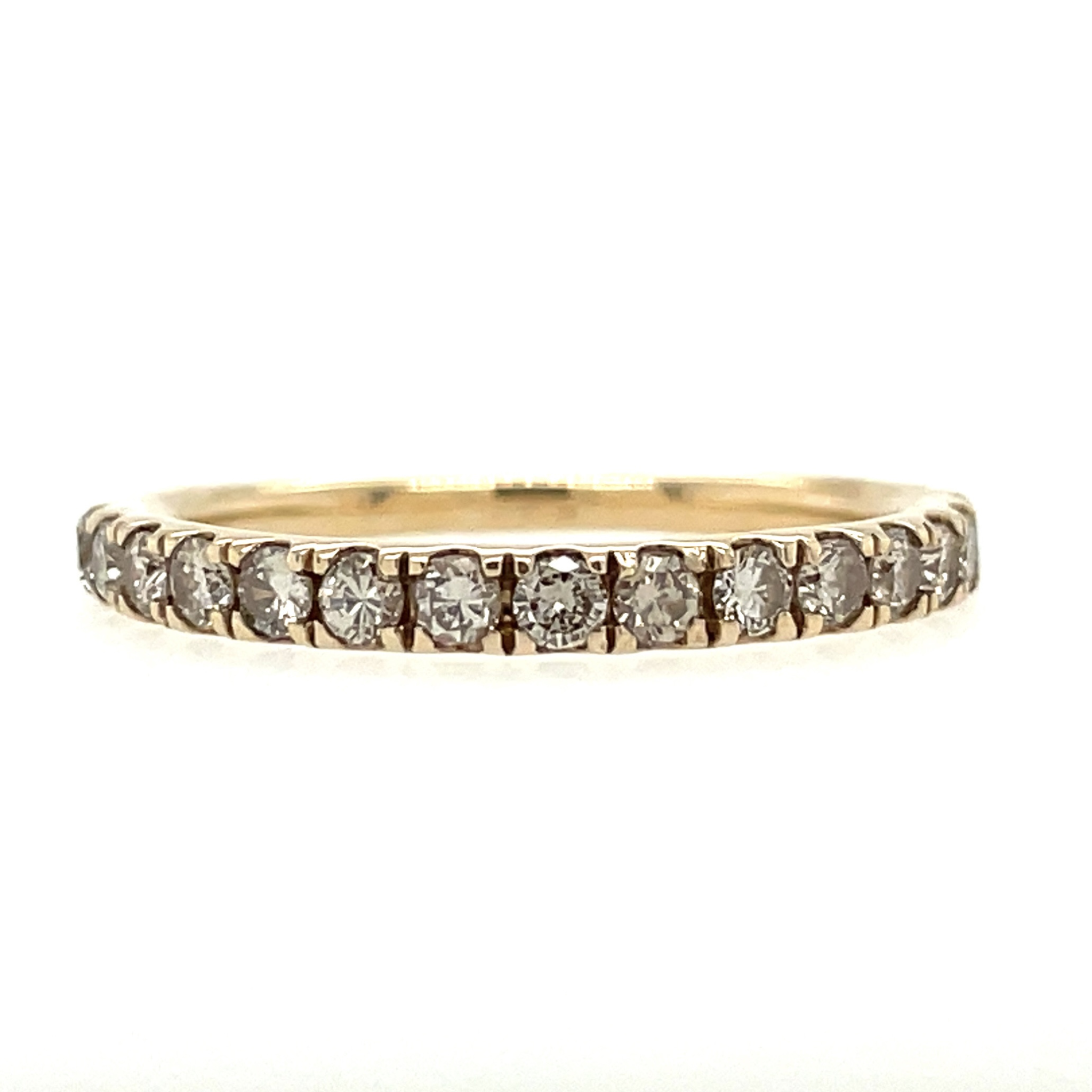 Celebrate lasting love with this 14K yellow gold anniversary band featuring 1/2 carat total weight of natural round diamonds. A timeless wedding or stacking ring with brilliant sparkle and classic elegance.