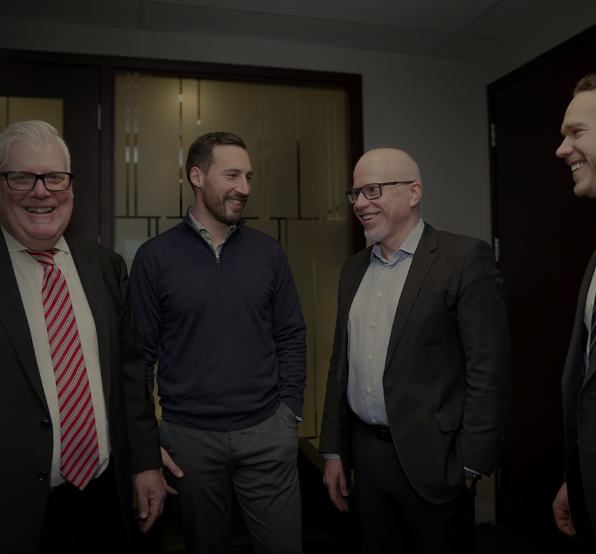 Greg Thompson and Rob Smith smiling alongside partners Dustin Rallo and James Kopp.