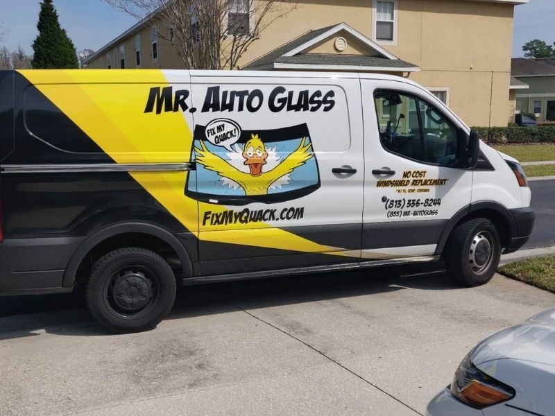 One of our wrapped vans on a mobile windshield job in a Tampa Bay neighborhood.