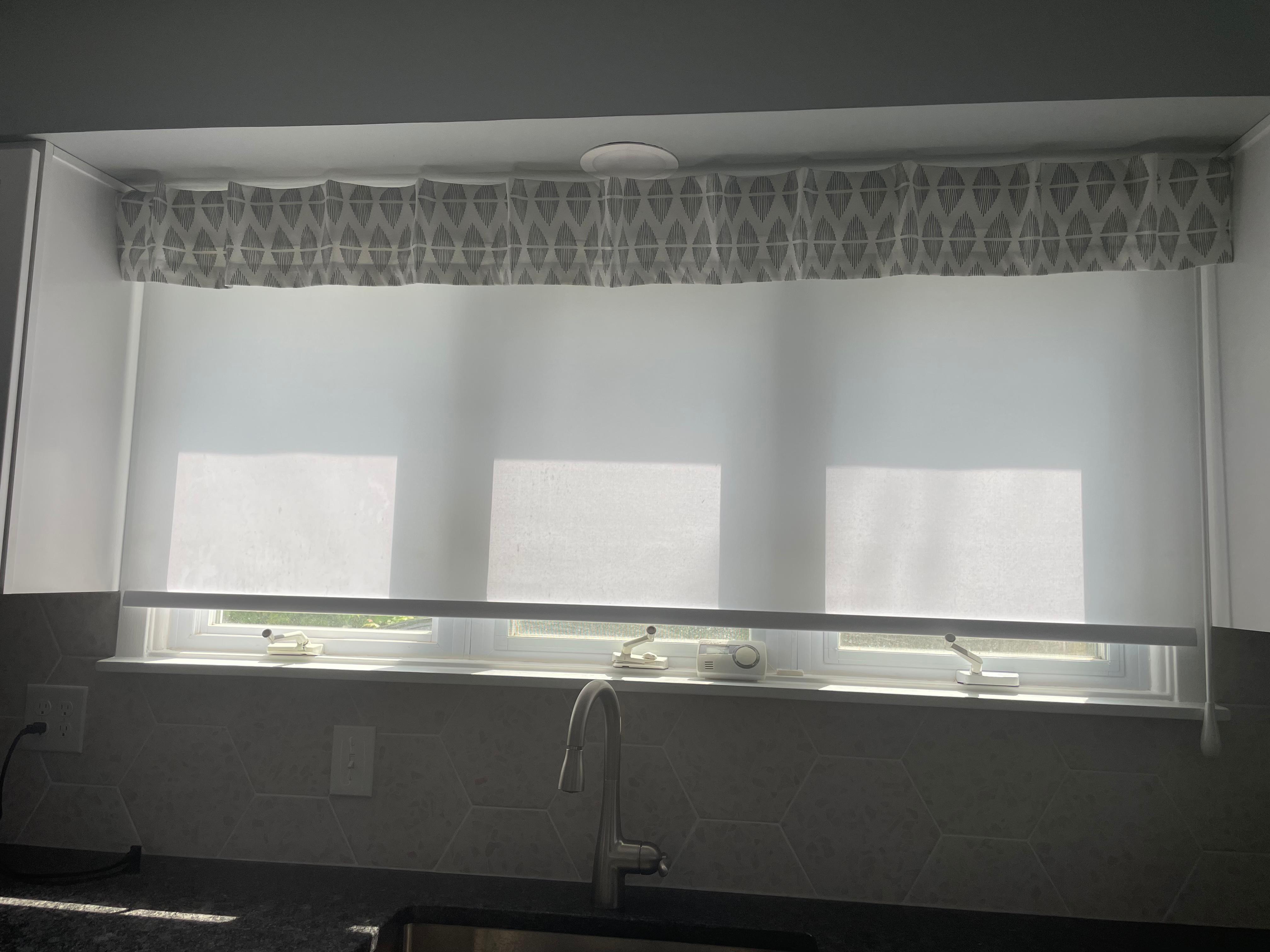 Add a light-filtering roller shade and valance to update your kitchen!