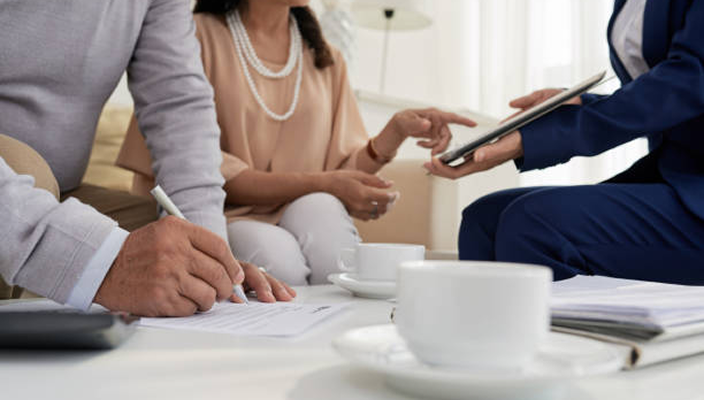 Close-up of advisors and clients collaborating.