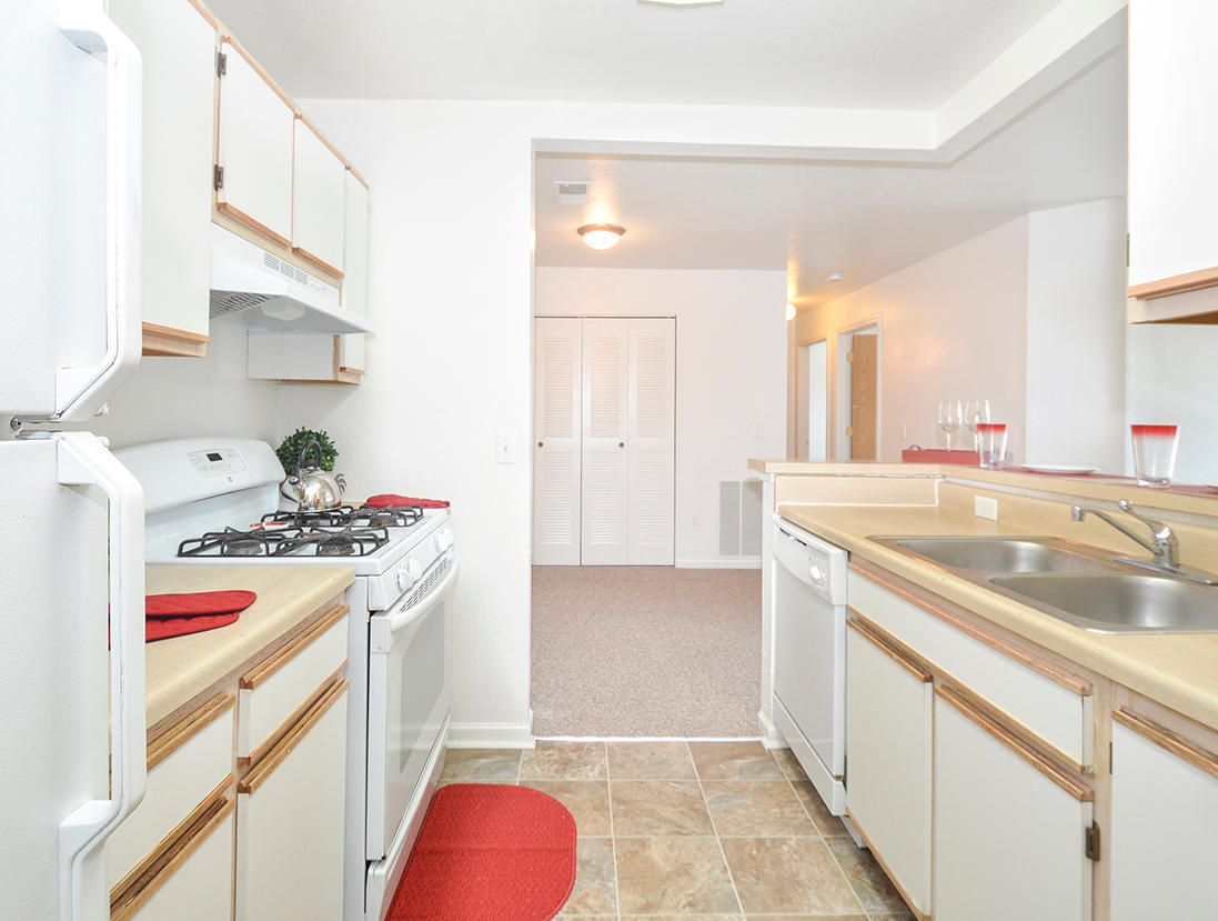 Fully-Equipped Kitchens With White Appliances