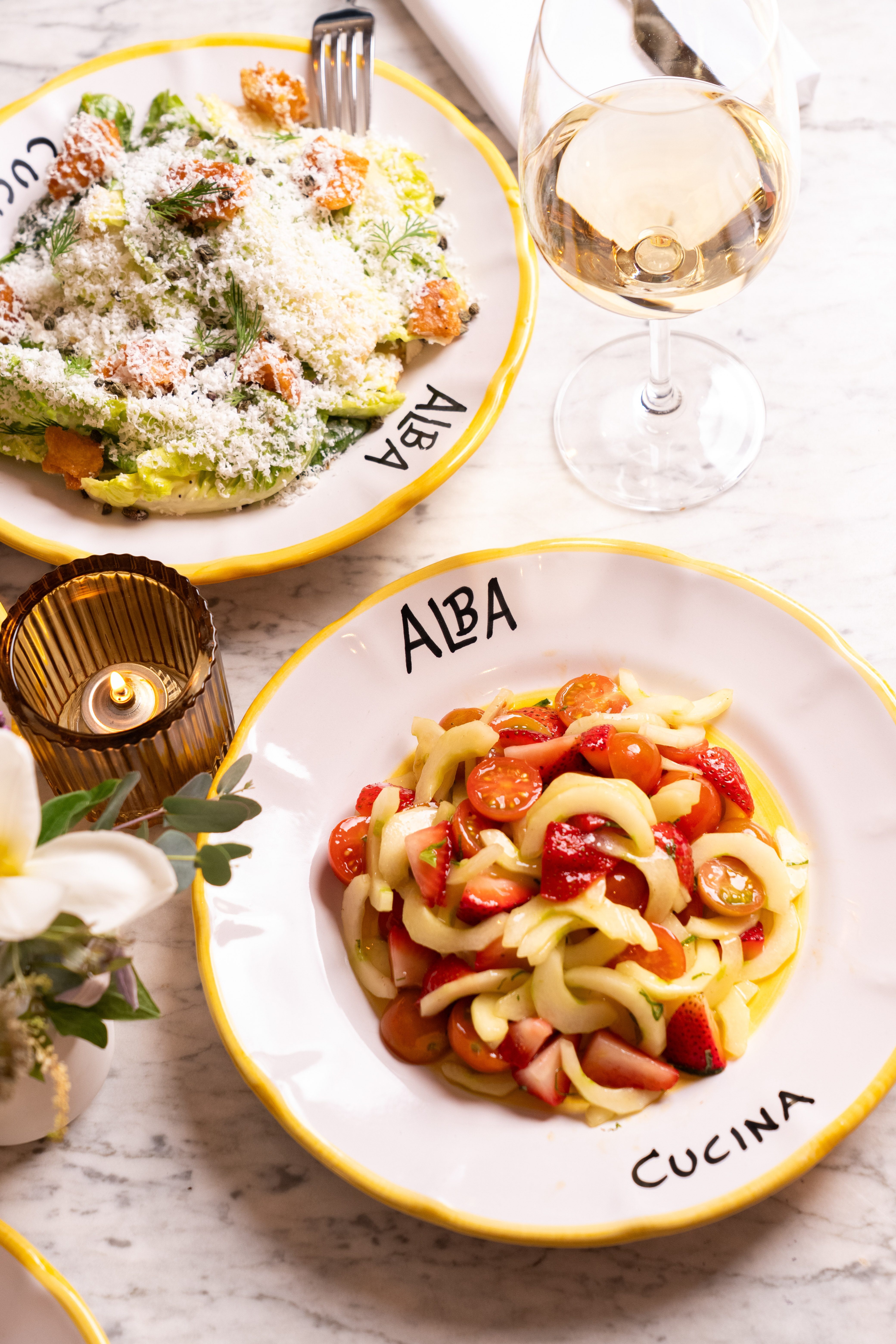 Indoor-outdoor dining at Alba Spiaggia at Montauk Yacht Club with marina views.