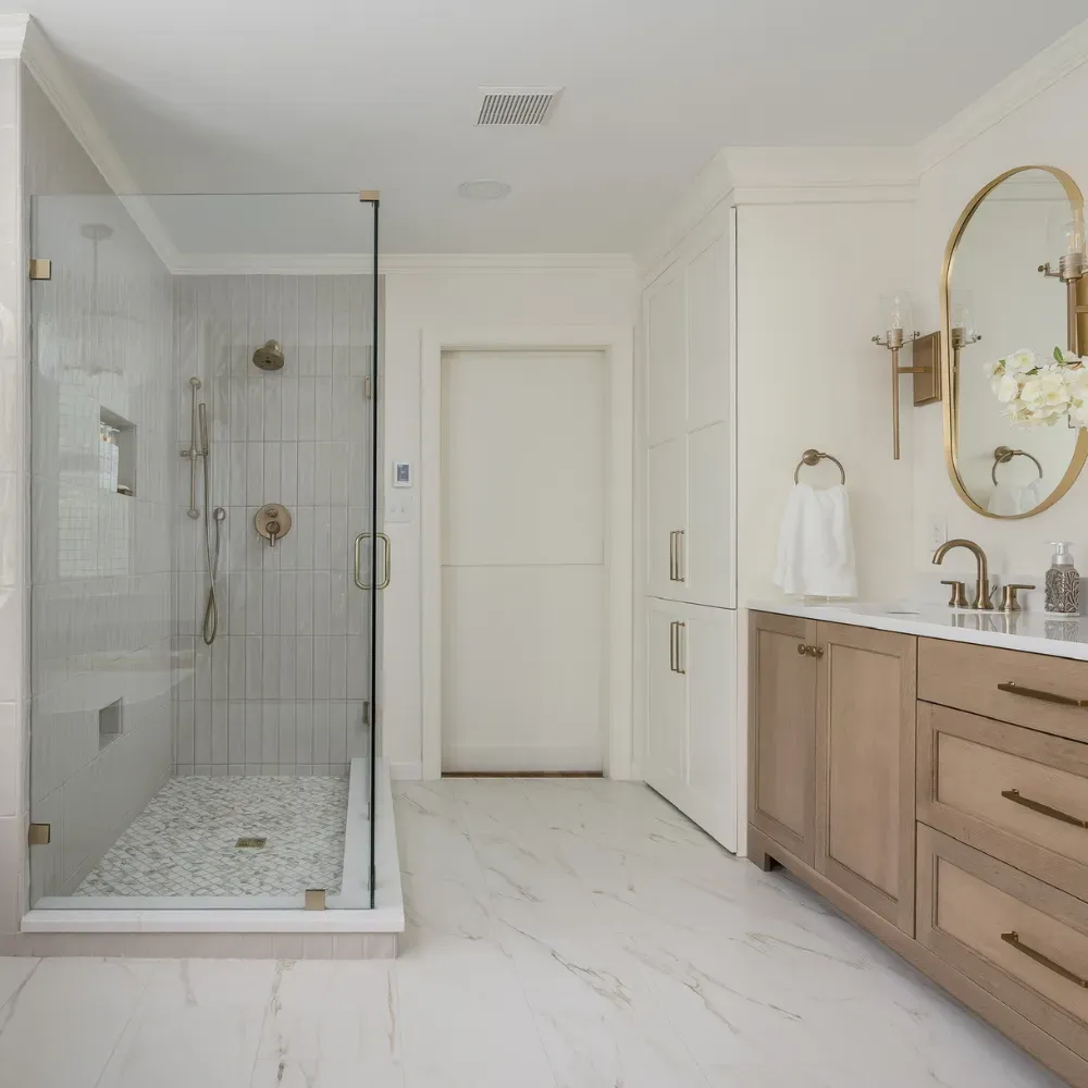 Luxury bathroom renovation in Central North Carolina featuring a custom glass shower, modern tile work, and a spacious layout. Designed and built by a professional bathroom remodeling contractor serving the Badin Lake area.