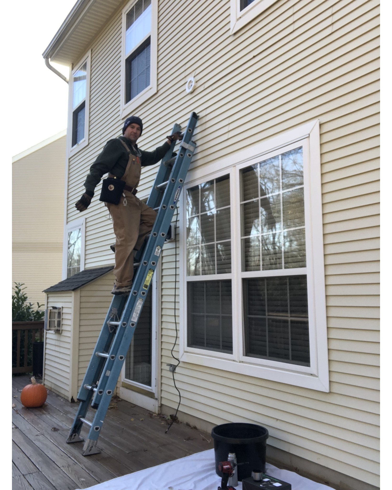 Installing some exterior electrical lighting on a cold morning.