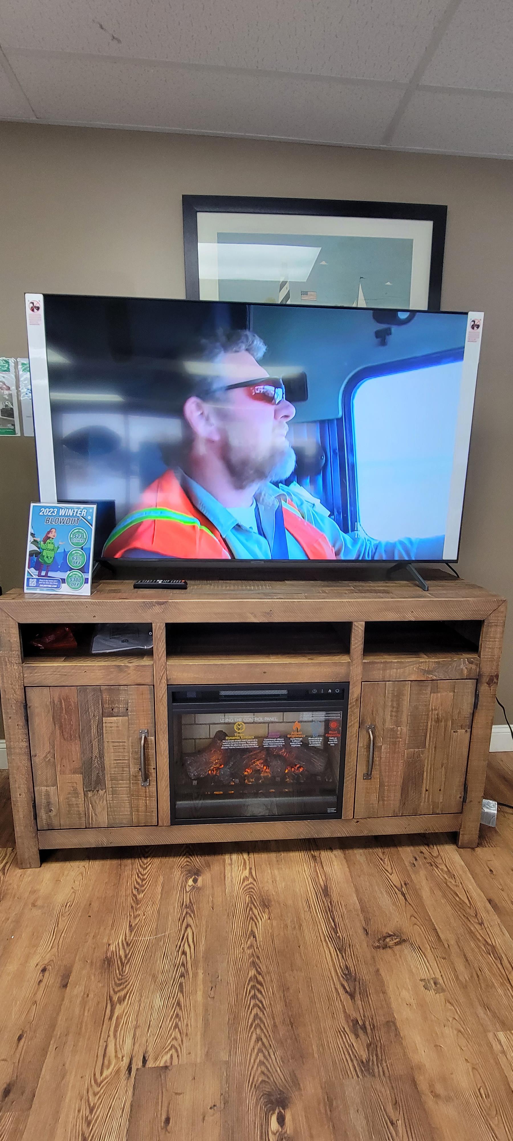 Samsung smart tv with Fireplace tv stand.