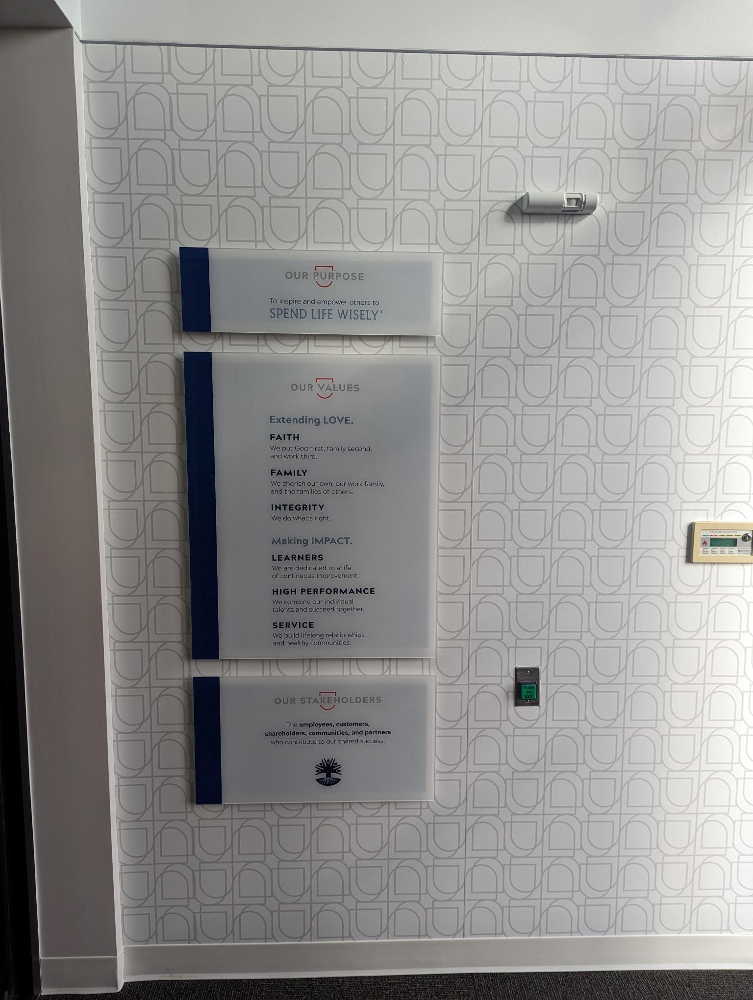 First United Bank - Prosper - interior "Spend Life Wisely" sign