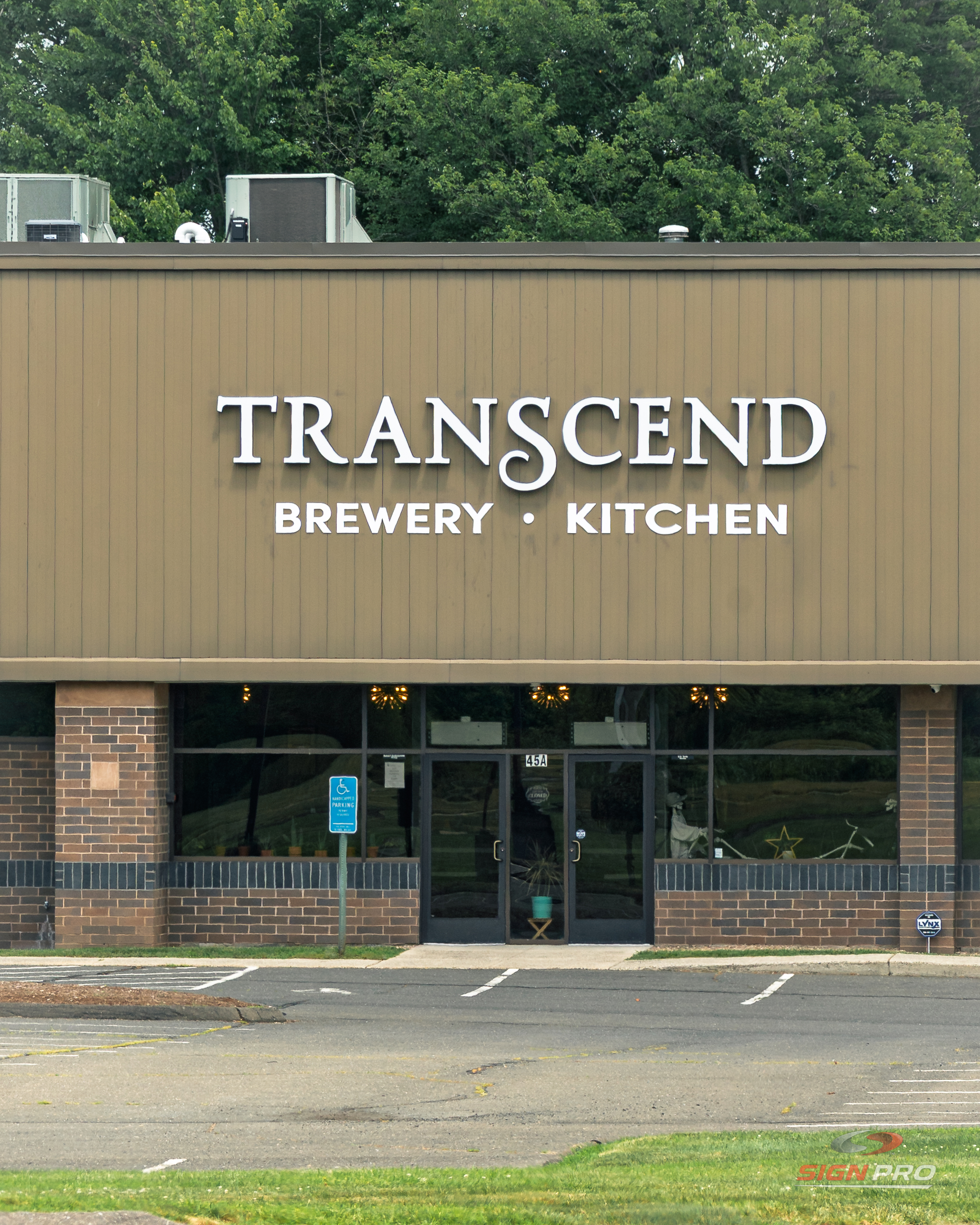 Custom channel letter storefront signage installed by Sign Pro for Transcend Brewery & Kitchen.
