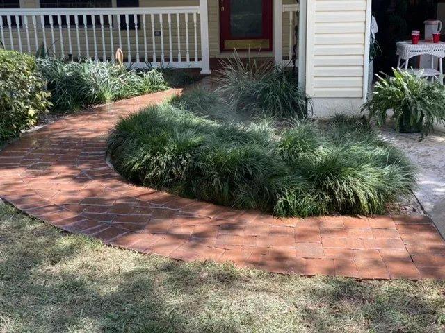 In Davenport at what is known as Four-Corners is an inviting paver walkway from the driveway to the front door