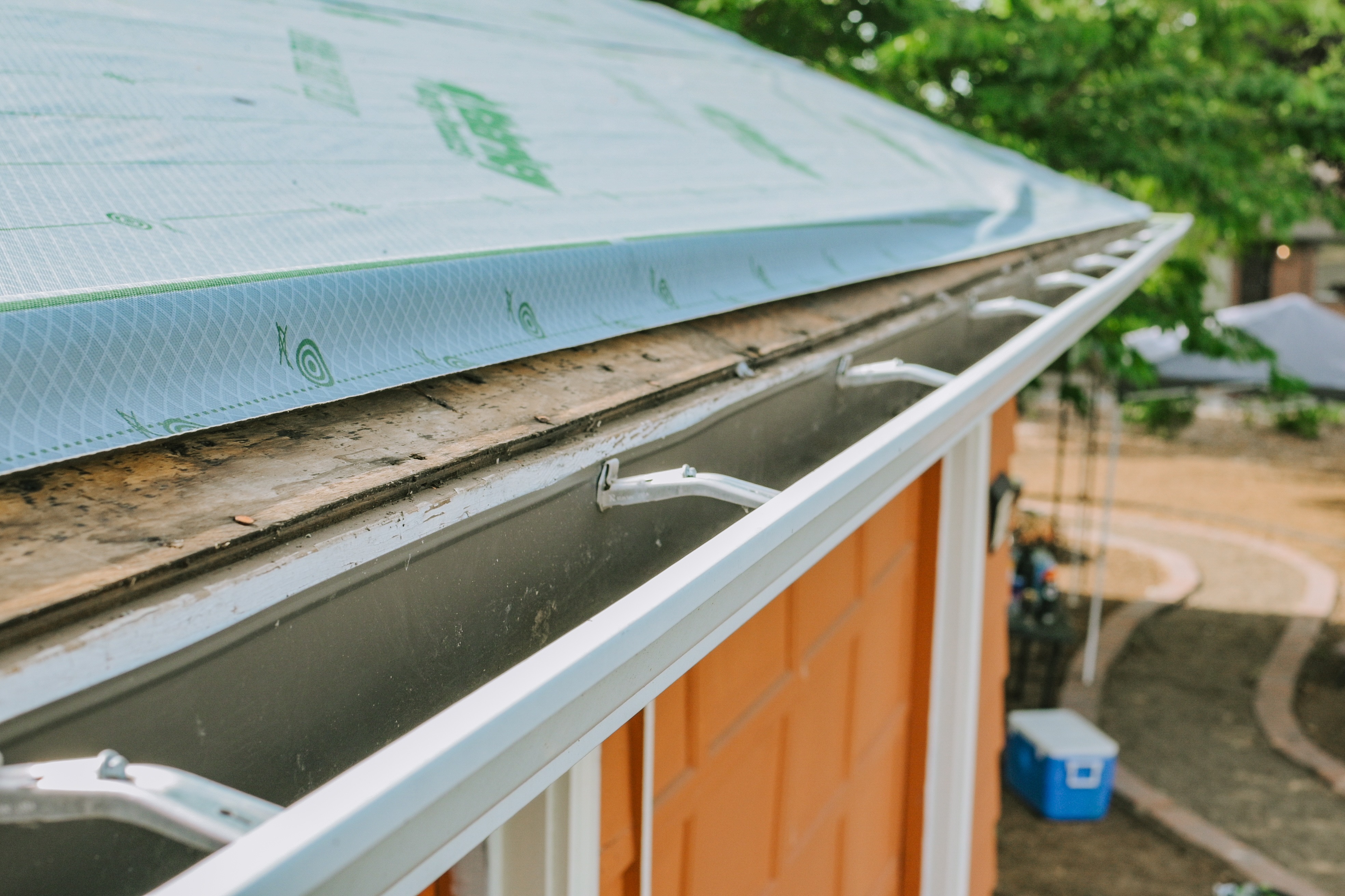 Roof edge and gutter detail shown during a residential roofing project. 