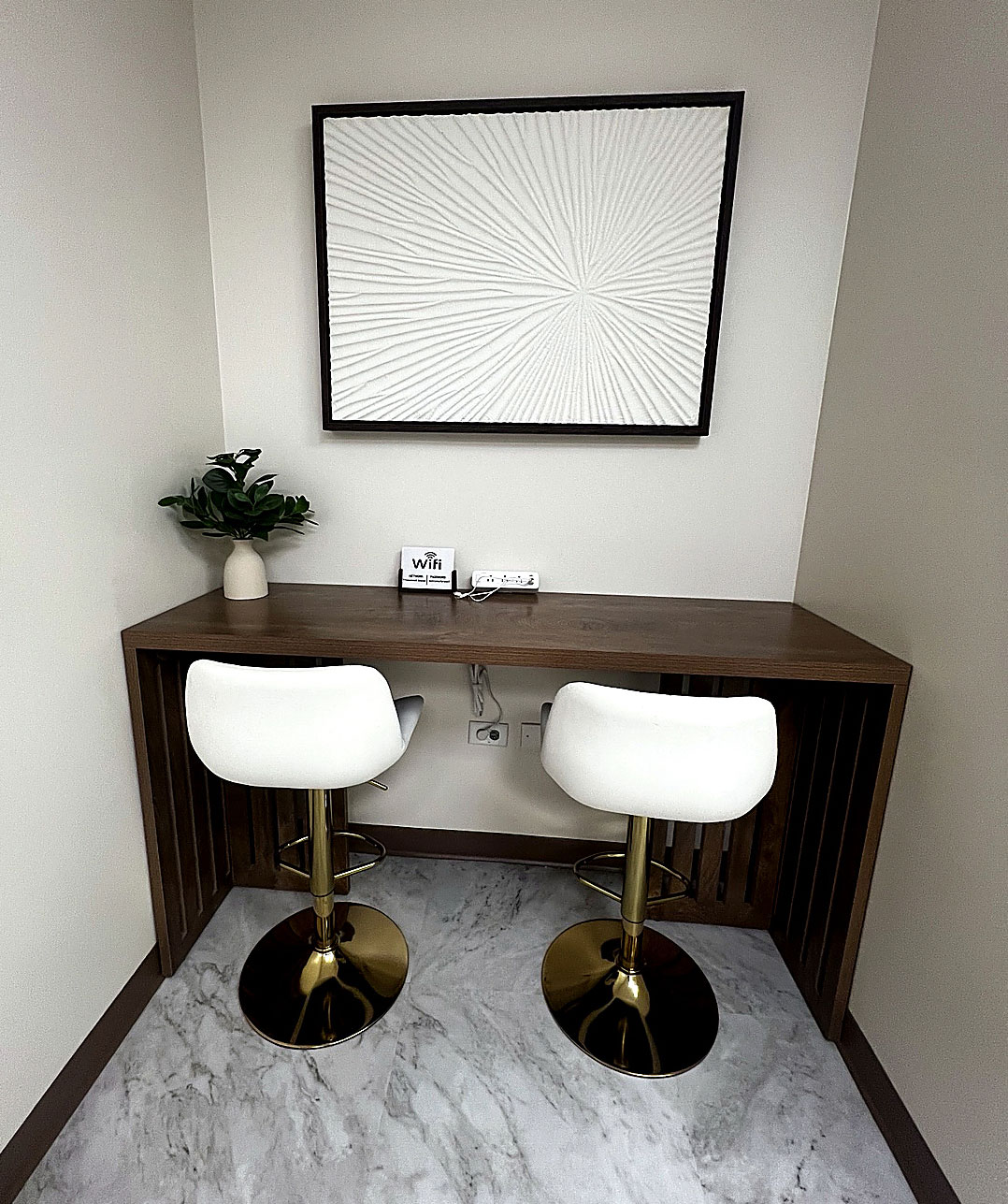 Modern consultation and workspace area at Transcend Functional Health in Greenwood Village, featuring contemporary furnishings, comfortable seating, and a peaceful clinical setting.