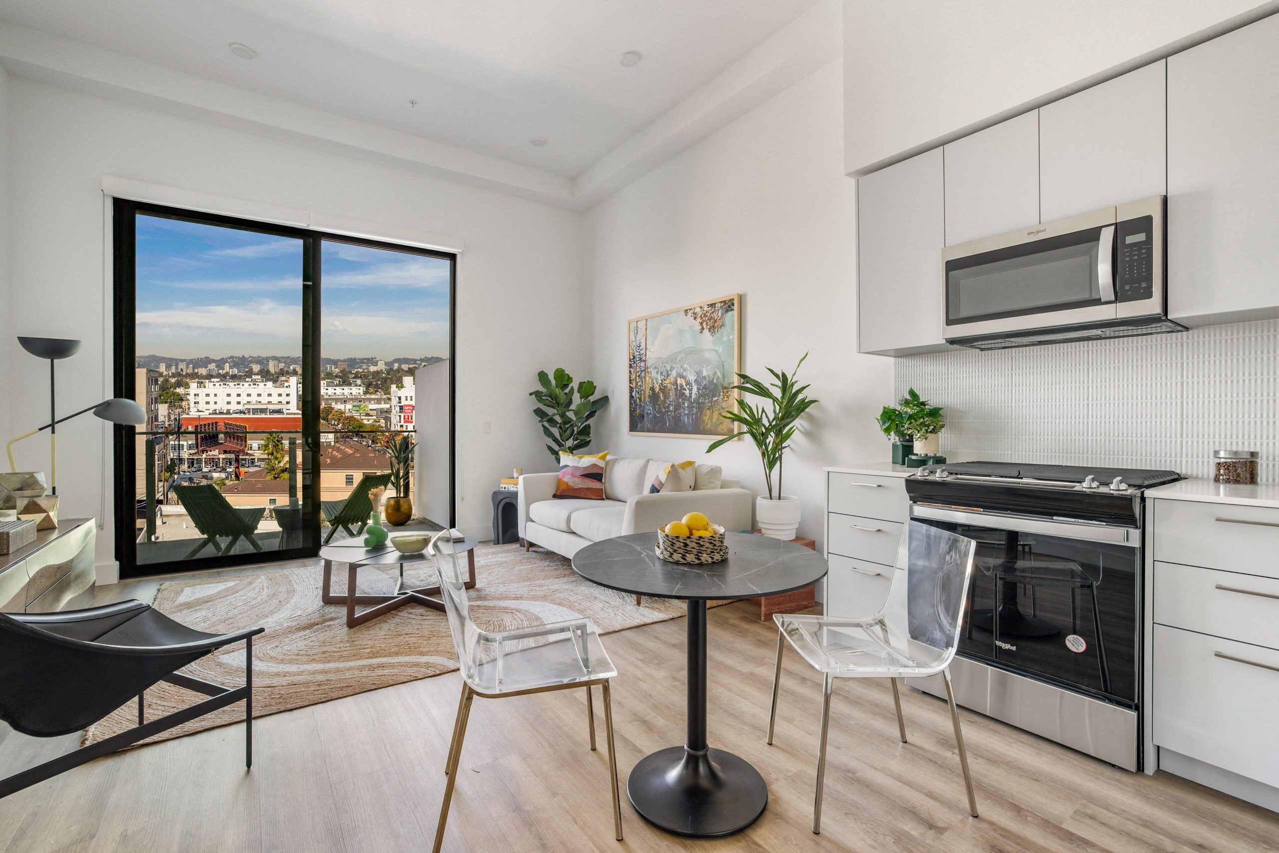 A modern kitchen with a view of the city.