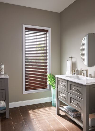 When you need privacy, faux wood blinds answer the call.  This faux wood complements the flooring an Budget Blinds of Kitchener & Guelph Guelph (519)341-4561