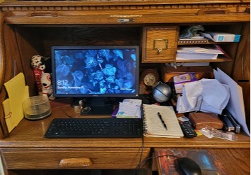 A photo of the desk I work at in my home. I am a one-woman business.