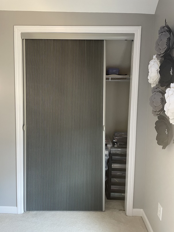 Vertical Cellular Shades by Budget Blinds of Kennesaw & Acworth are a versatile option that can be used a practical alternative to a solid door in your home for a closet! #BudgetBlindsKennesawAcworth #ShadesofBeauty #FreeConsultation #CellularShadesClosetDoor