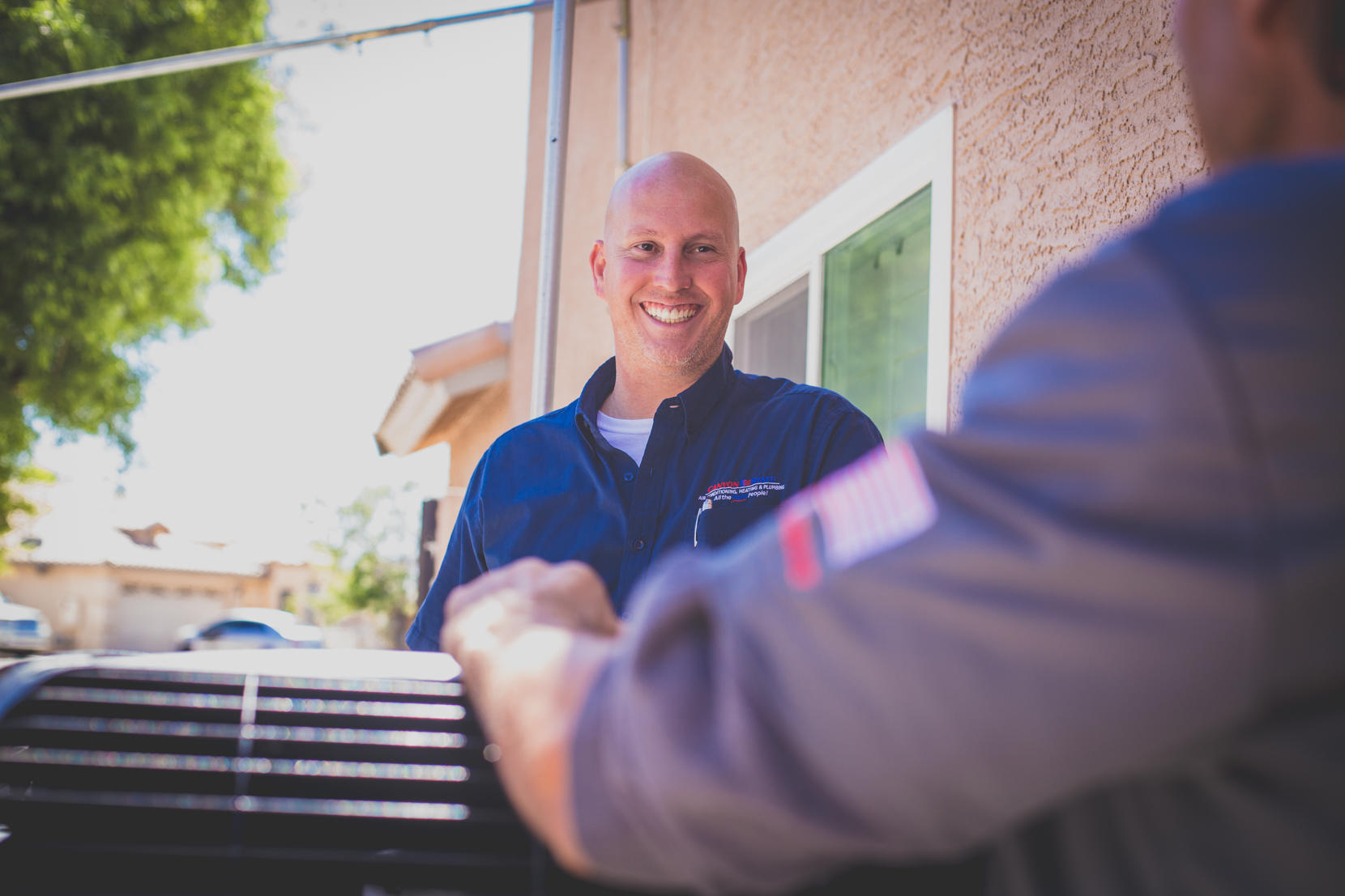 Canyon State install team member speaking with the Trane Comfort Advisor
