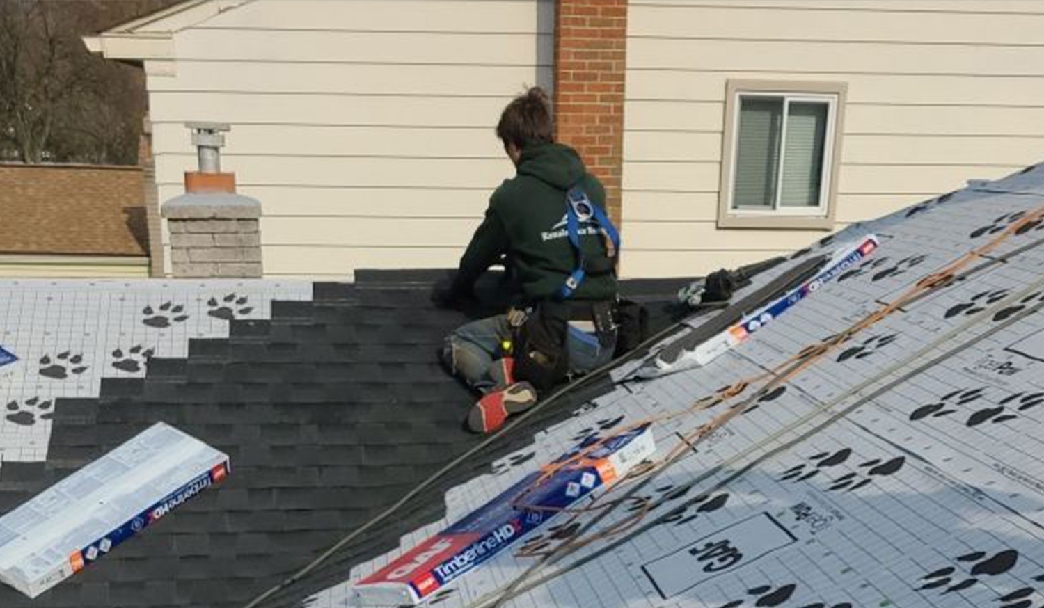 contractor repairing roof